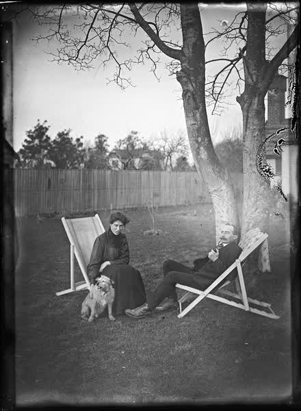 Man and woman in canvas deckchairs, 1900