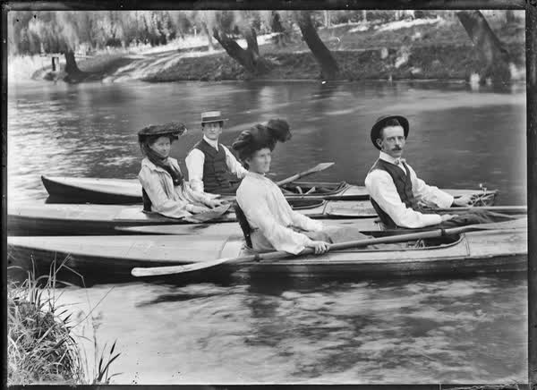 Two men and two women in canoes on the Avon River, 1900