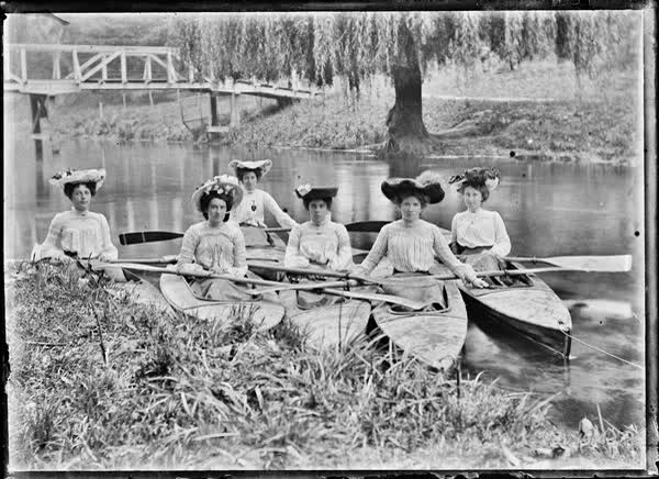 Six women in canoes on the Avon River, 1900
