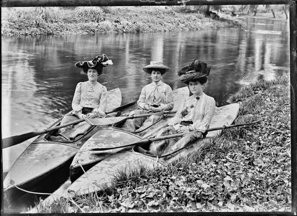 Three women in canoes on the Avon River, 1900