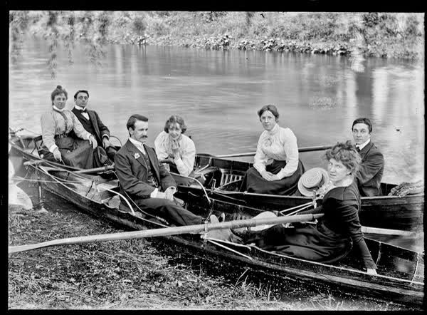 Three men and four women in rowboats on the Avon River, 1900