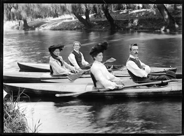 Two men and two women in canoes on the Avon River, 1900