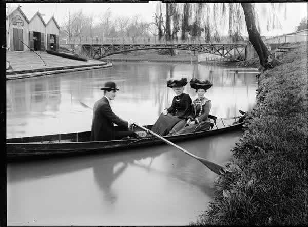 Two women and a man in a rowboat on the Avon River, 1900