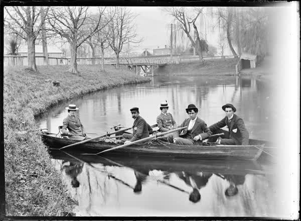 Three men and two women in rowboats on the Avon River, 1900