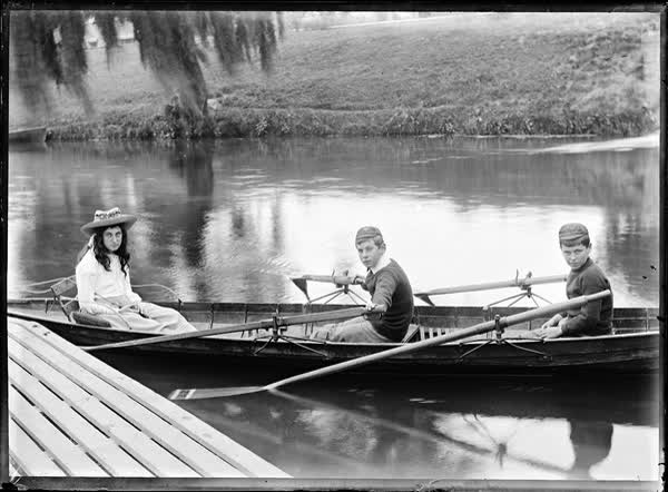 Girl and two boys in a rowboat on the Avon River, 1900