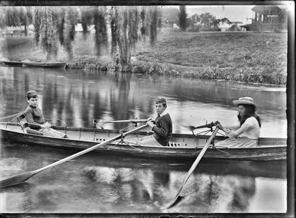 Girl and two boys in a rowboat on the Avon River, 1900