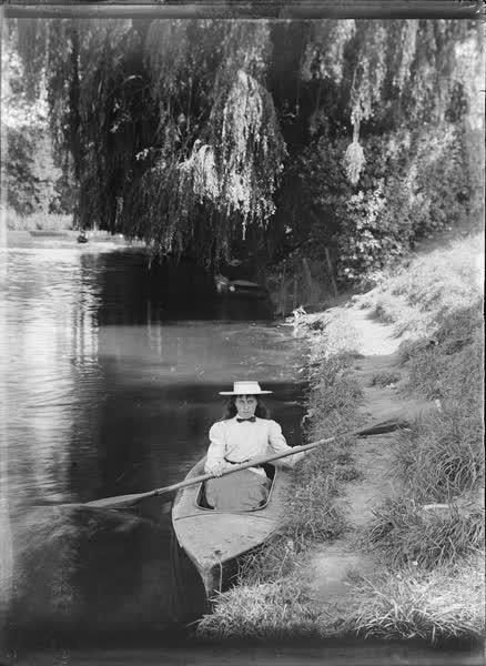 Woman in a canoe on the Avon River, 1900