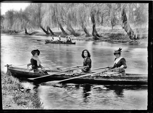 Three women in a double rowboat on the Avon River, 1900