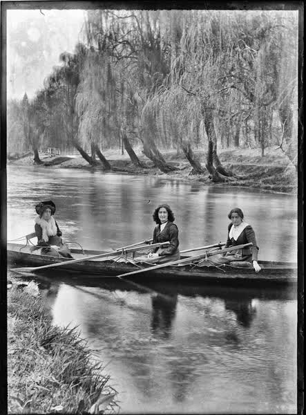 Three women in a double rowboat on the Avon River, 1900