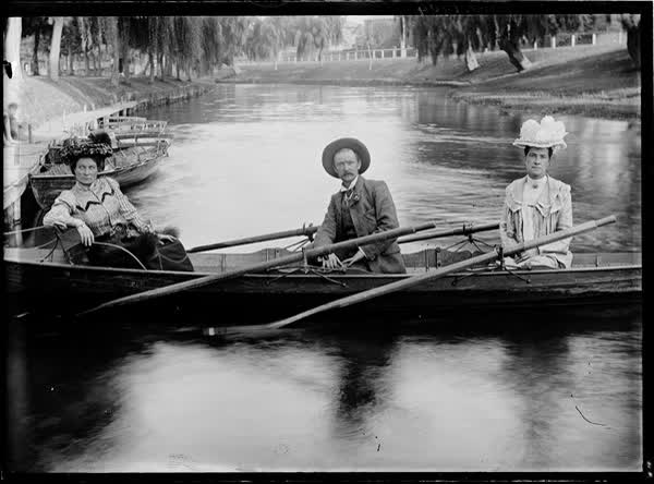 Man and two women in a double rowboat, January 1904, 1904