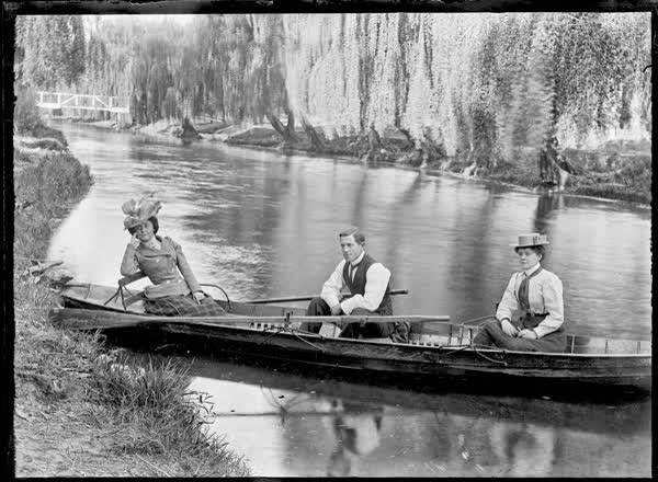 Two women and a man in a rowboat on the Avon River, 1900