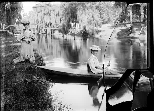 Two women with a canoe by the Avon River, 1900
