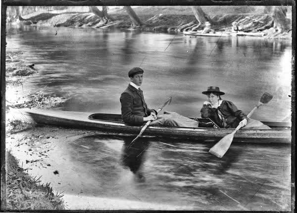 Boy and girl in a canoe on the Avon River, 1900