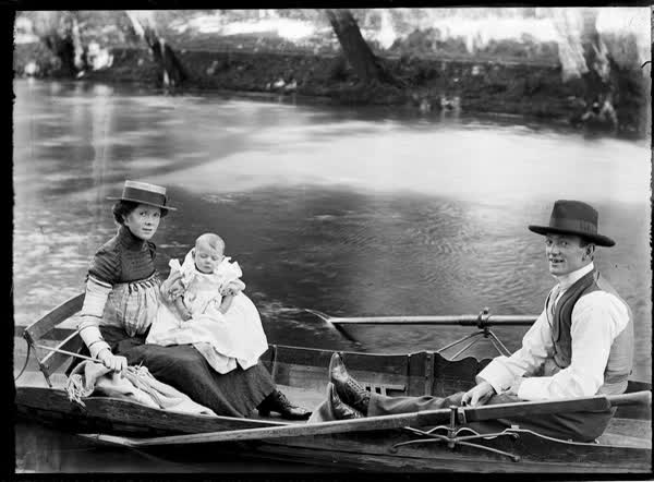 Man, woman and a baby in a rowboat on the Avon River, 1900