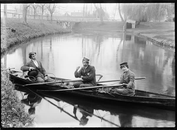 Three men in a rowboat on the Avon River, 1900