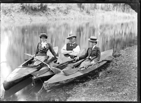 Man and two women in canoes on the Avon River, 1900