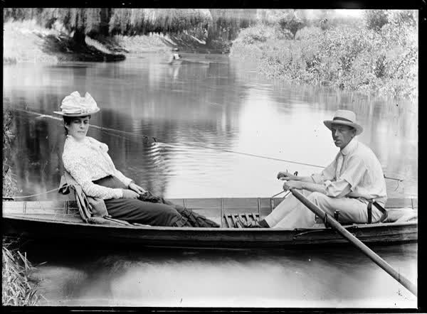 Man and woman in a tethered rowboat on the Avon River, 1900