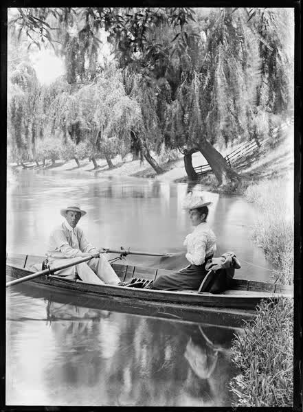 Man and woman in a tethered rowboat on the Avon River, 1900