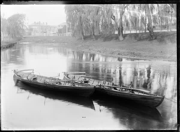 Two empty rowboats on the Avon River, 1900