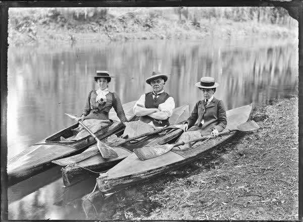 Man and two women in canoes on the Avon River, 1900