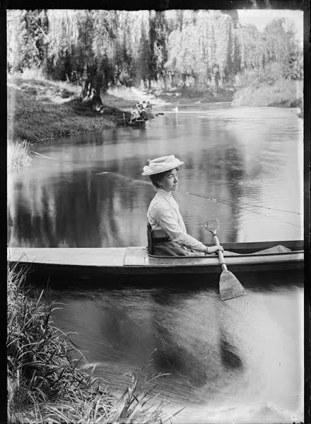 Woman in a tethered canoe on the Avon River, 1900