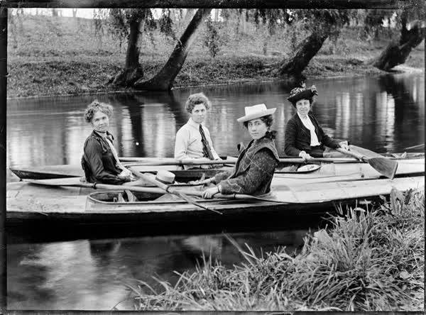 Four women in canoes on the Avon River, 1900