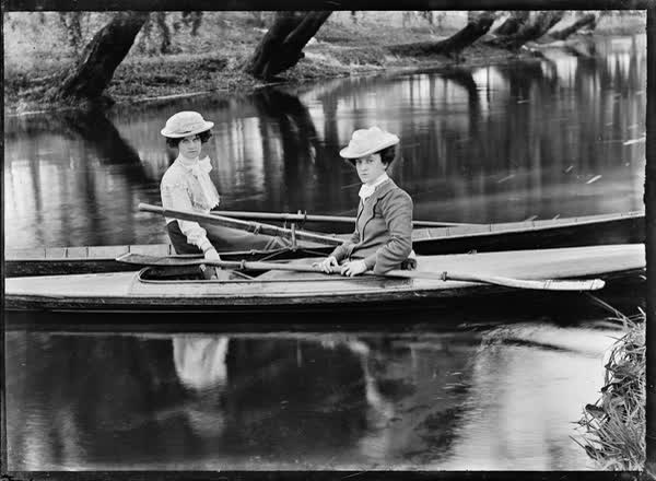 Two women in a canoe and a rowboat on the Avon River, 1900