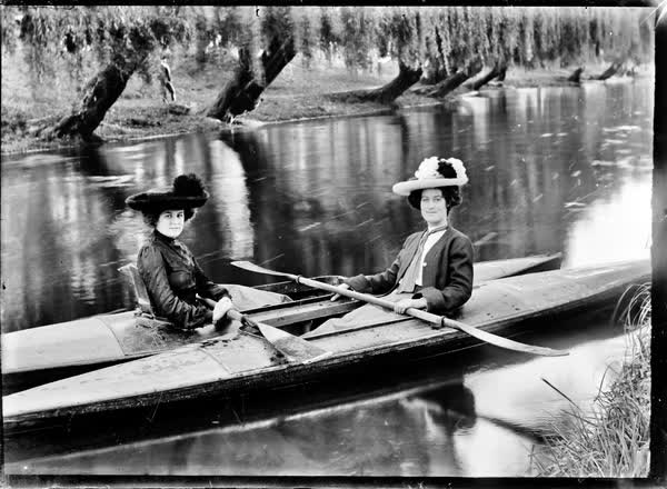 Two women in canoes on the Avon River, 1900