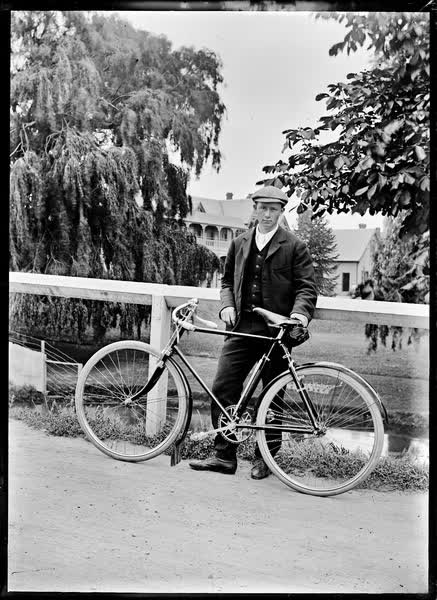 Man with racing bicycle, 1900
