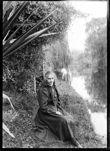 Girl seated by the Avon River, 1900