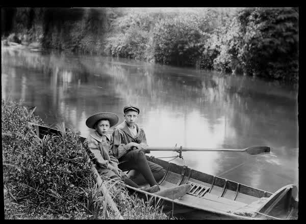 Two boys in a rowboat on the Avon River, 1900