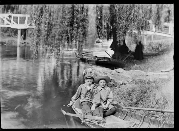 Two boys in a rowboat on the Avon River, 1900
