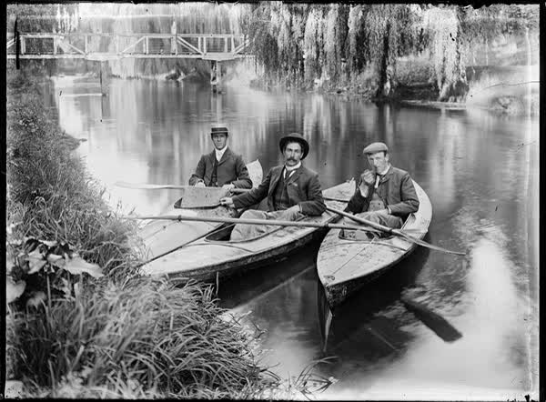 Three men in canoes on the Avon River, 1900
