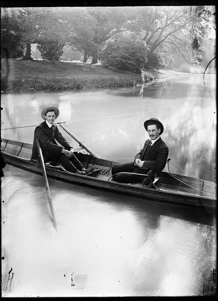 Two men in a tethered rowboat on the Avon River, 1900