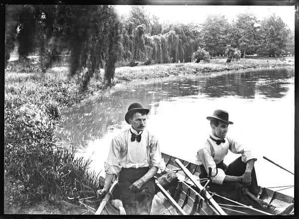 Two men in rowboats on the Avon River, 1900