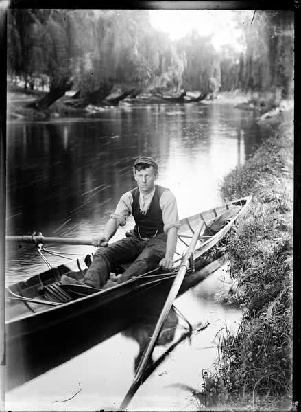 Young man in a rowboat on the Avon River, 1900