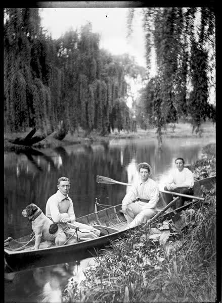 Three men and a bulldog on the Avon River, 1900