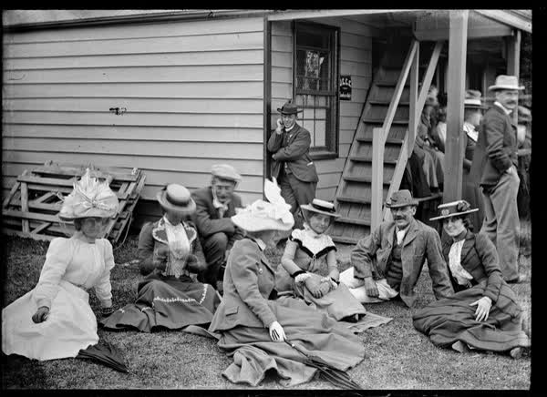 Large group in front of weatherboard building, 1900