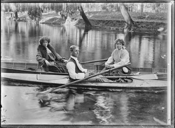 Two women and a man in a rowboat on the Avon River, 1900