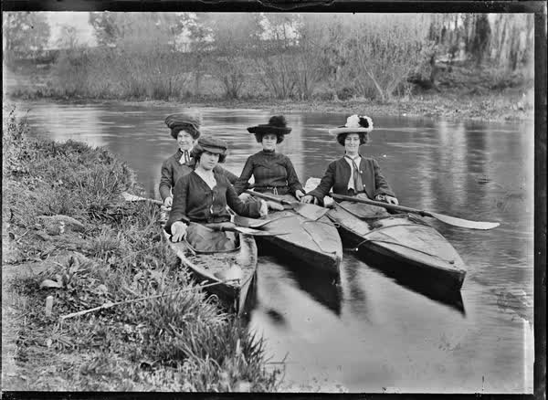 Four women in canoes on the Avon River, 1900