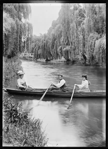 Man and two women in a double rowboat on the Avon River, 1900