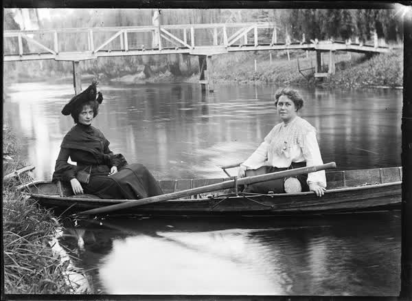Two women in a rowboat on the Avon River, 1900