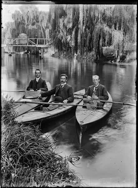 Three men in canoes on the Avon River, 1900