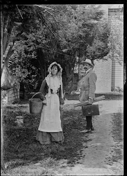 Man and woman in a garden, 1900