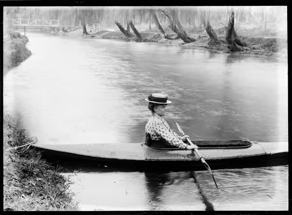 Woman in a canoe on the Avon River, 1900