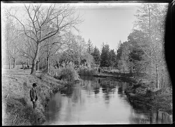 River with man and toi, 1900