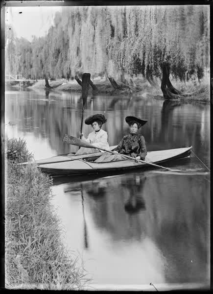 Two women in canoes on the Avon River, 1900
