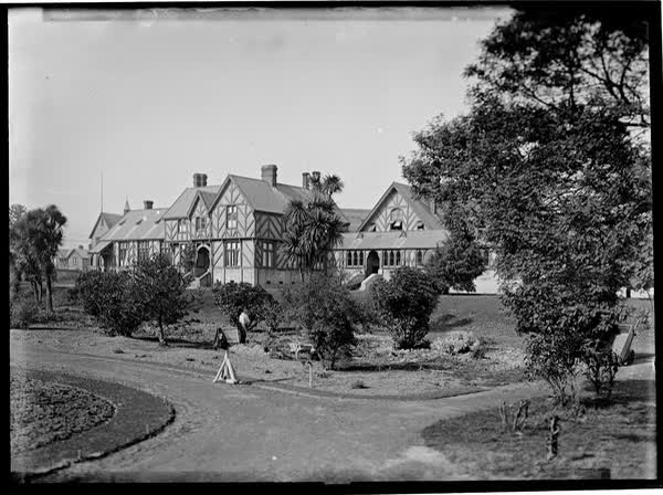Christchurch Hospital with paths and gardens, 1900