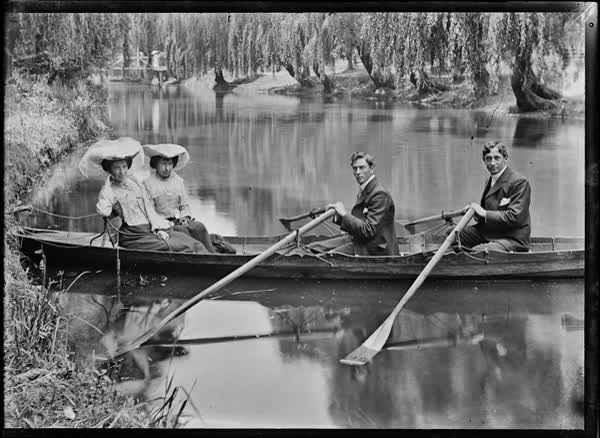 Two men and two women in a rowboat on the Avon River, 1900