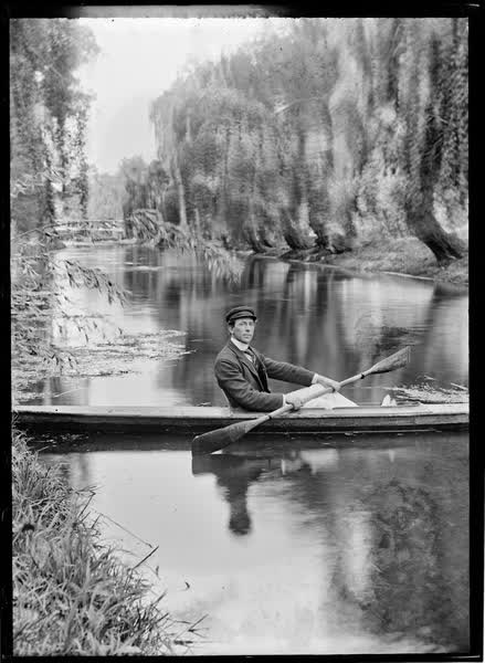 Man in a canoe on the Avon River, 1900